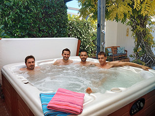 Guysers spa pool with guests